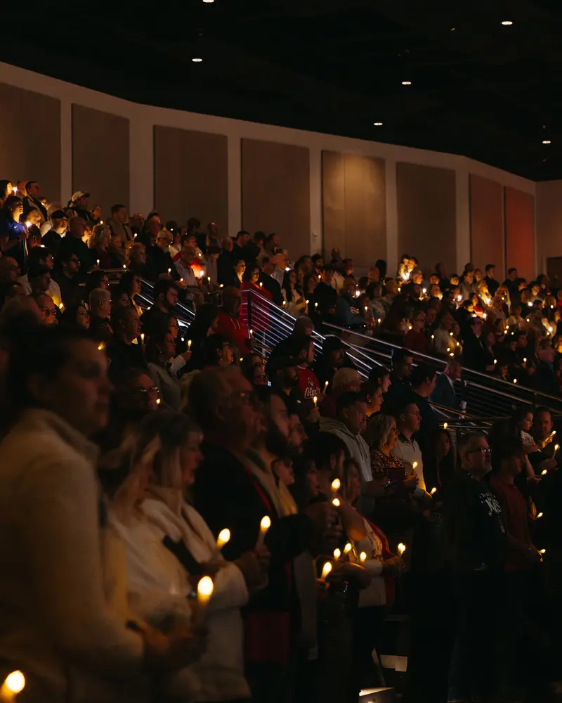 People holding candles during the Christmas Eve candlelight moment